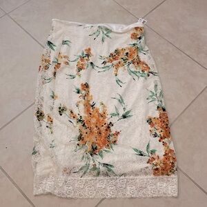 White lace midi-skirt with tropical flower lace.